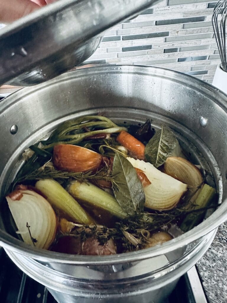 Homemade Turkey Stock Simmering on the Stove